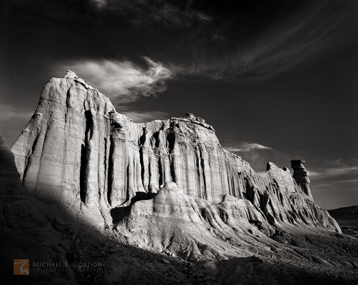 A lone sedimentary desert butte with hoodoo&nbsp;eroded into a unique&nbsp;castle-like&nbsp;cliff.Logos and watermarks are not...