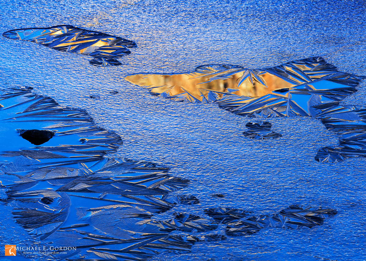 Evening granite reflected in an ice-choked and crystal-laden pond. Tioga Tarns. Every photograph on this website and&nbsp;blog...