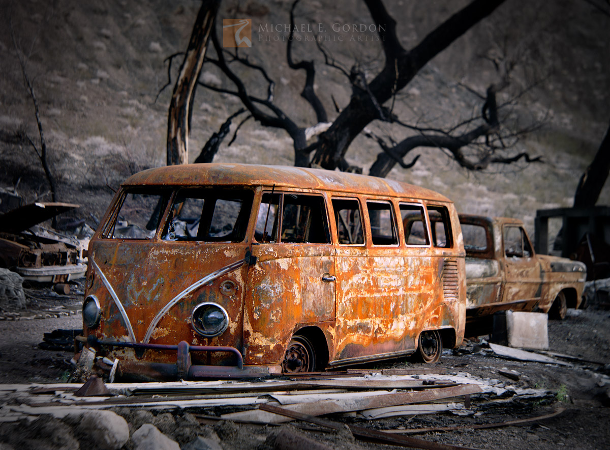 A burned out and rusted Volkswagen bus sits in a desert canyon on the western edge of Death Valley National Park.Logos and watermarks...