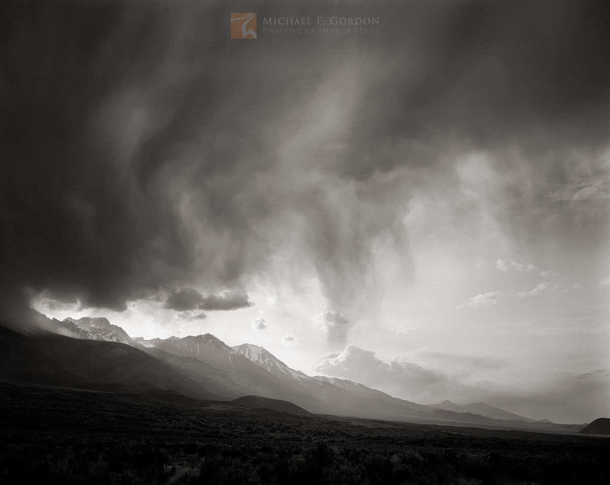 A thunderhead over the High Sierra unleashes rain on the Owens Valley.&nbsp; Logos and watermarks are not found on any printed...