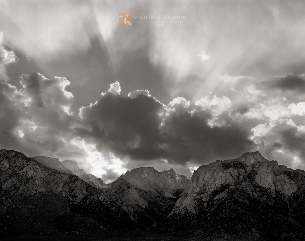 Afternoon cumulus clouds and anticrepuscular rays over (L-R) Mt. Langley (14,026′), Mt. Corcoran (13,760'), Mt. LeConte (13...