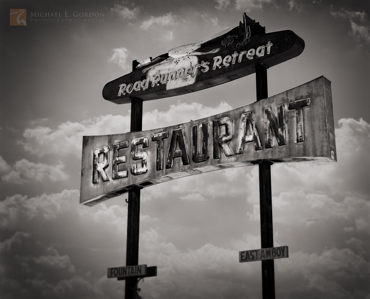 Roadrunner's Retreat Restaurant sign on Old Route 66.Logos and watermarks are not found on any printed product. This feature...