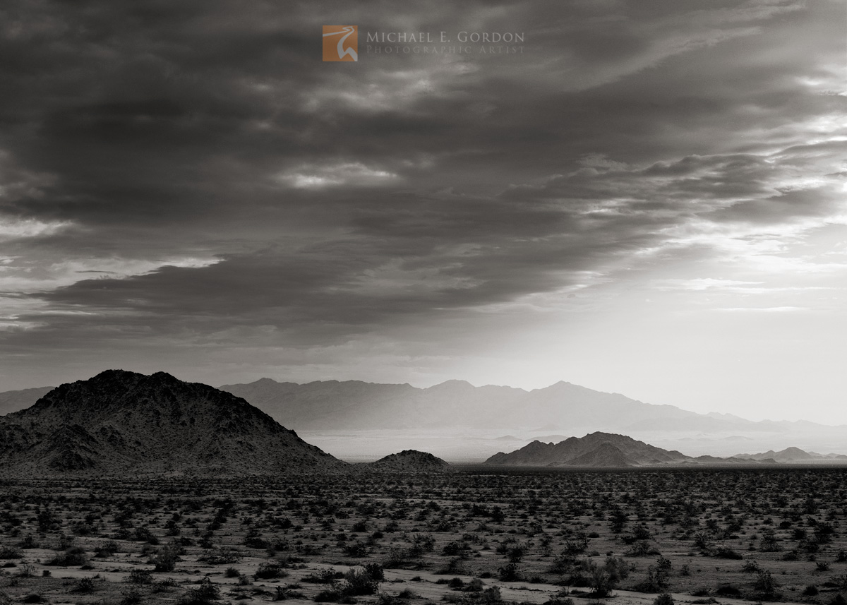 Light meets the receding edge of a&nbsp;winter storm over the eastern Mojave Desert.Logos and watermarks are not found on any...