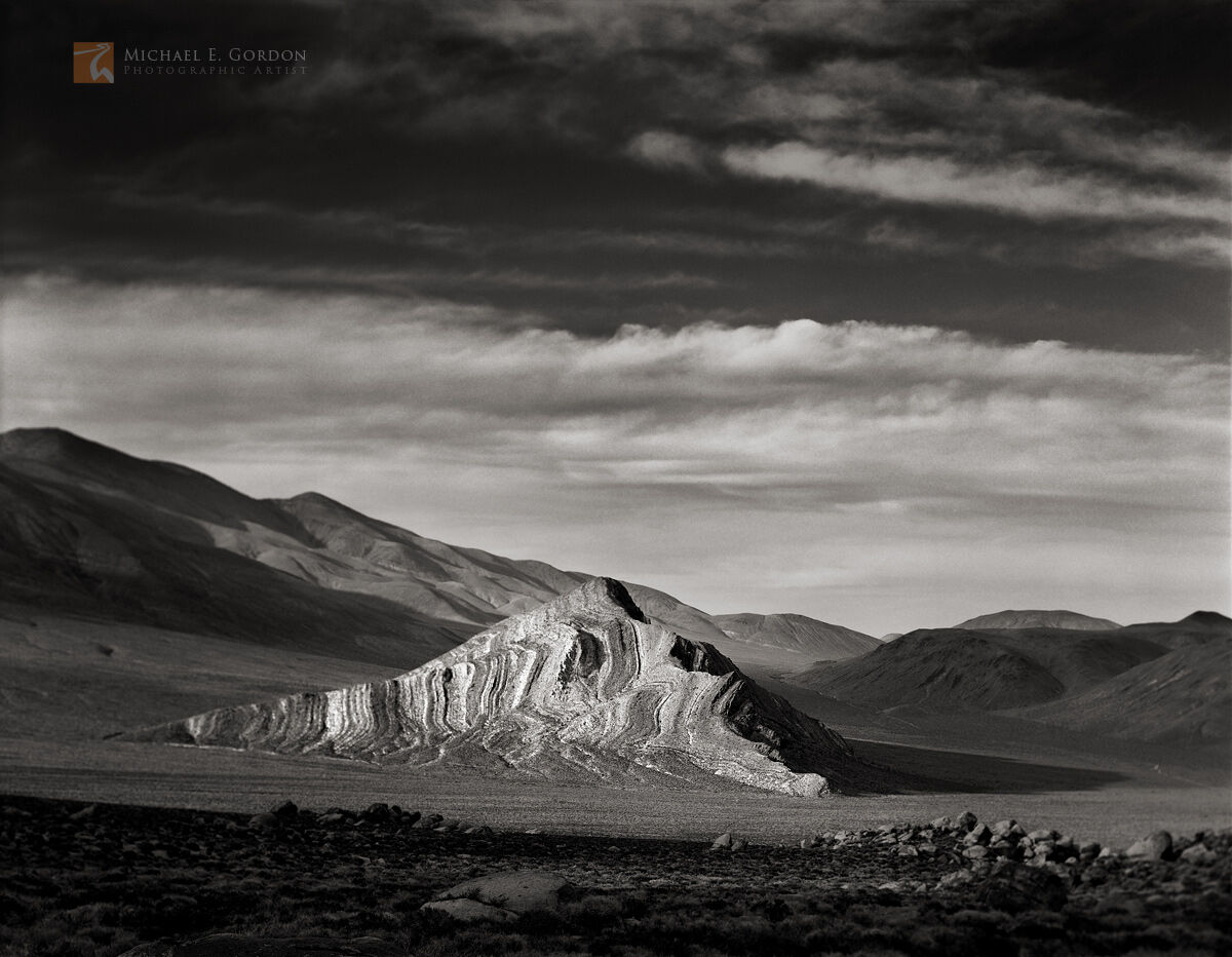 The incredible stratified limestone layers of Striped Butte in late afternoon light.Logos and watermarks are not found on any...